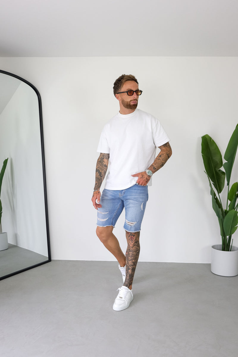 SLIM DENIM SHORT - LIGHT BLUE RIPPED